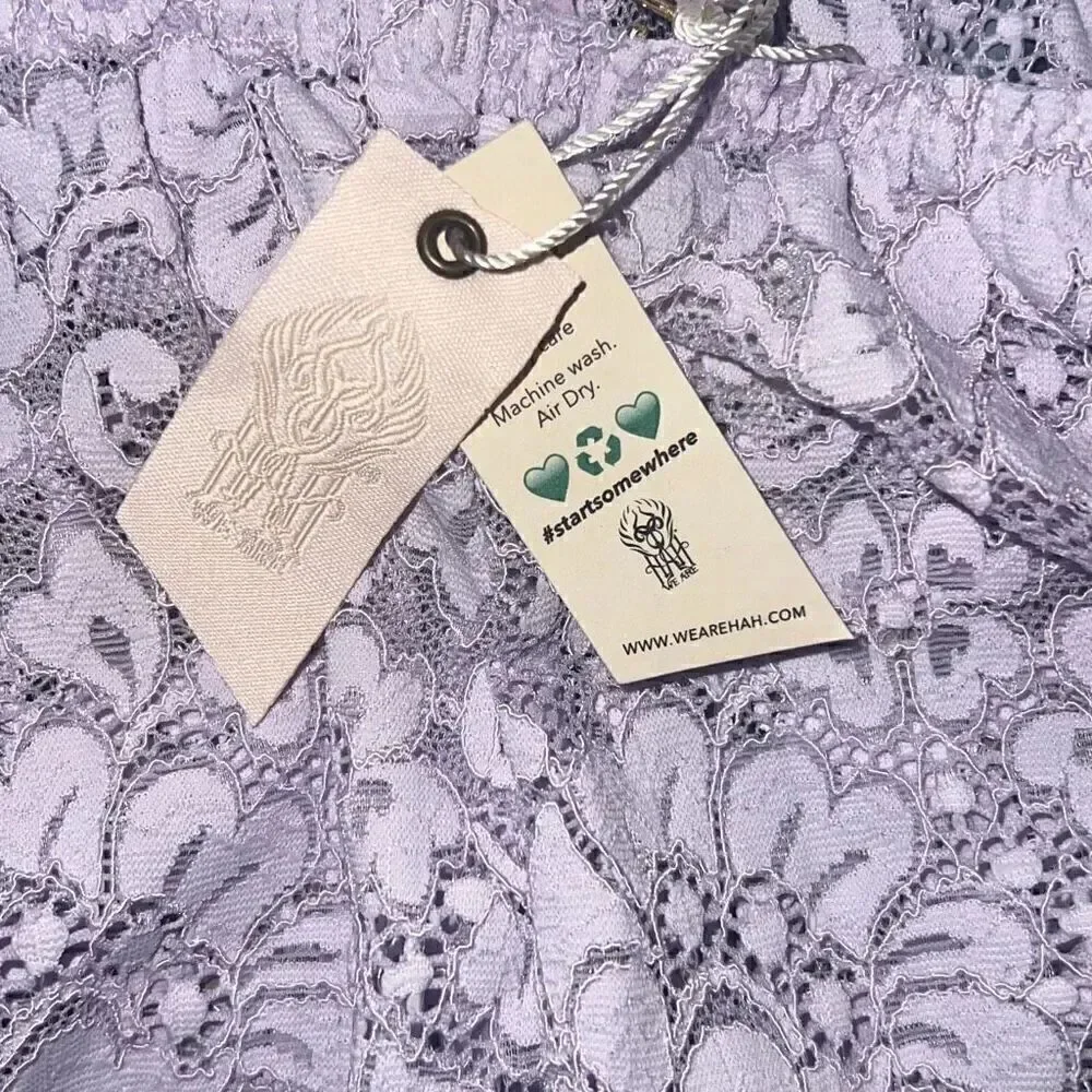 We are HAH Free People NWT comin in haht lace bodysuit purple XS